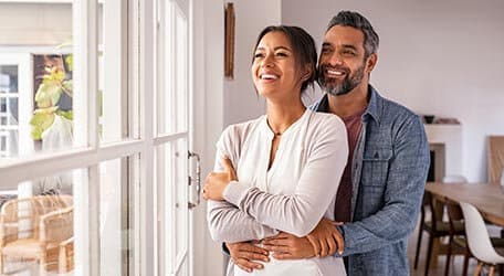 happy woman and man embracing